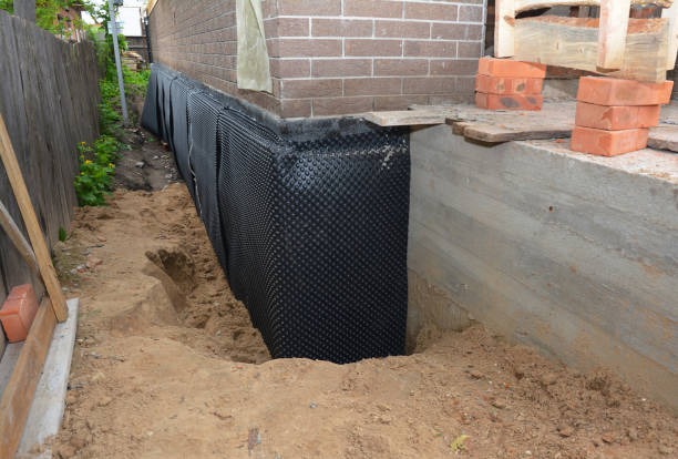 Happy homeowners after waterproofing job in West Bend